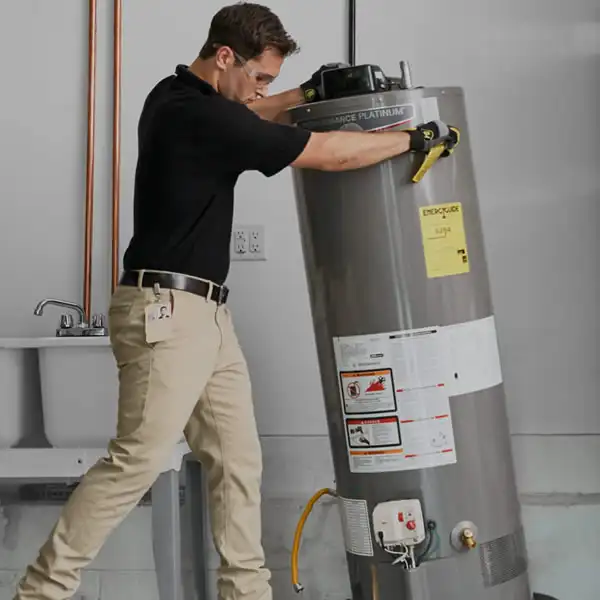 Technician replacing a water heater